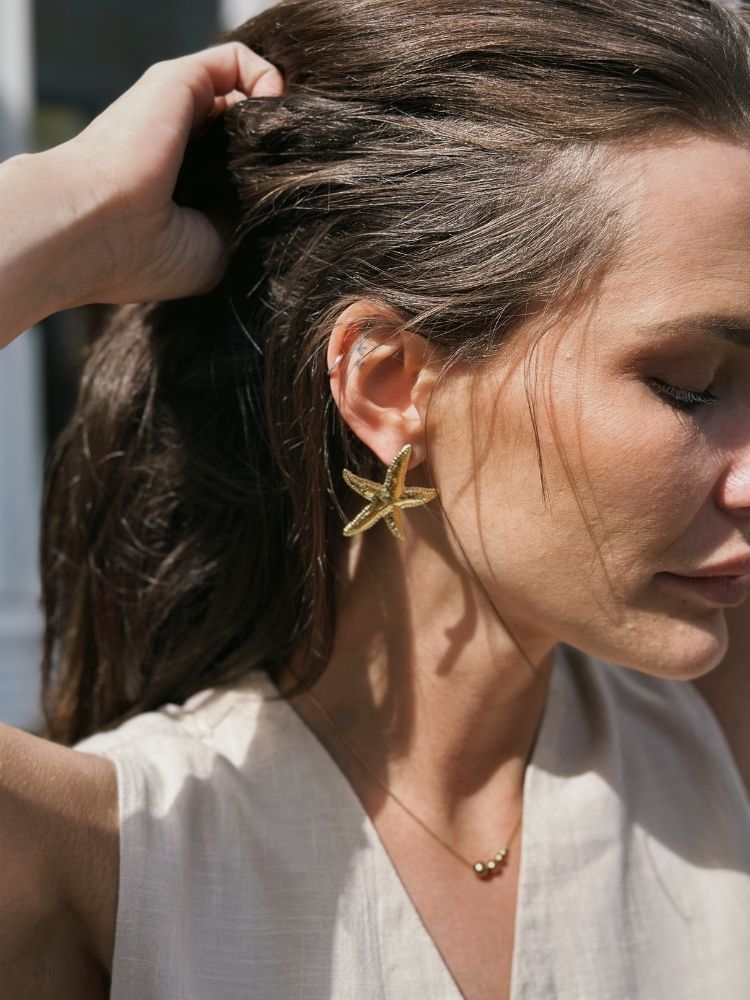 Syra søstjerneøreringe – Guld - Chant du Matin